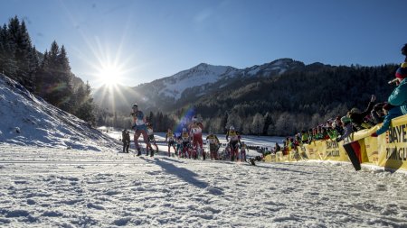 Athletes ascending mountain trail